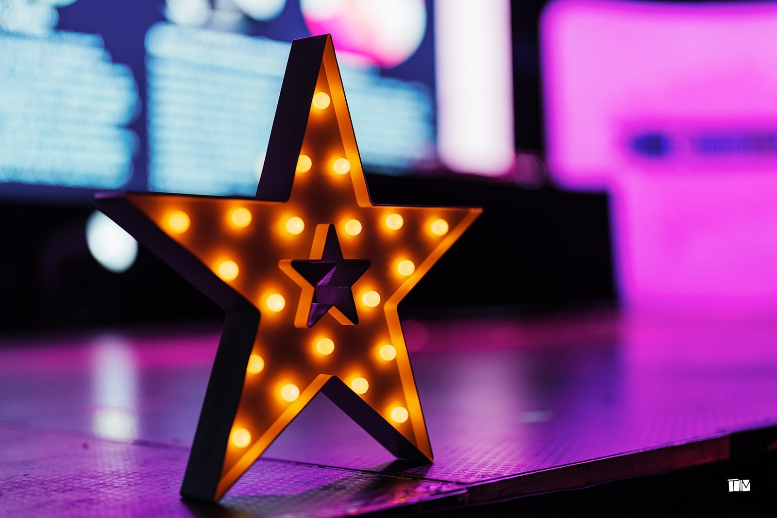 A light-up star on the stage at the DevelopHER Awards